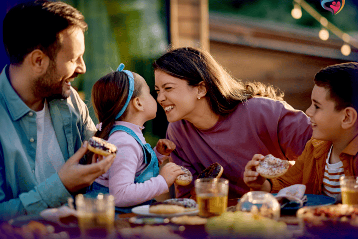 A happy family enjoying lunch with friends. they are not Stressed about Debt, Delinquent on their loans? because the took 3 steps to create a legacy.